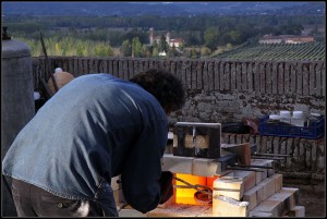 Firing a kiln with the valley of the Garonne behind